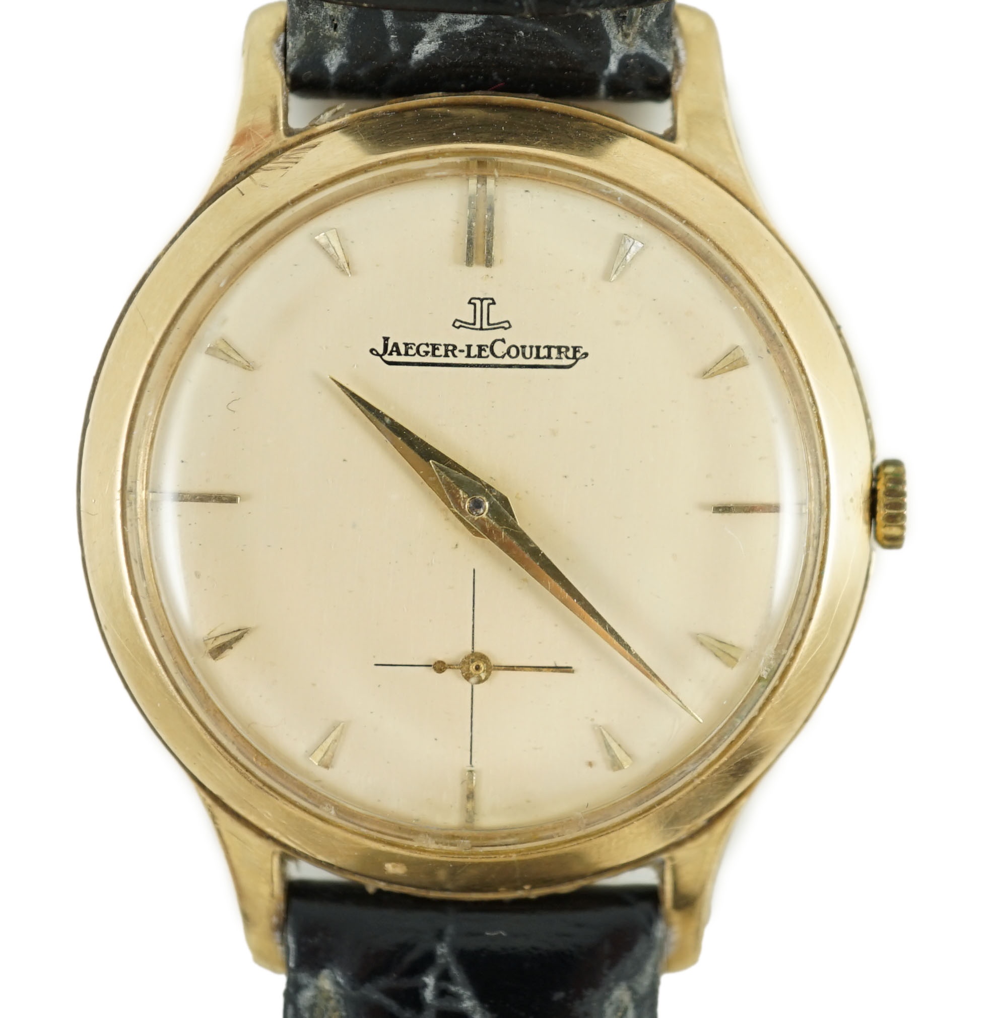 A gentleman's 9ct gold Jaeger LeCoultre manual wind dress wrist watch, on associated strap